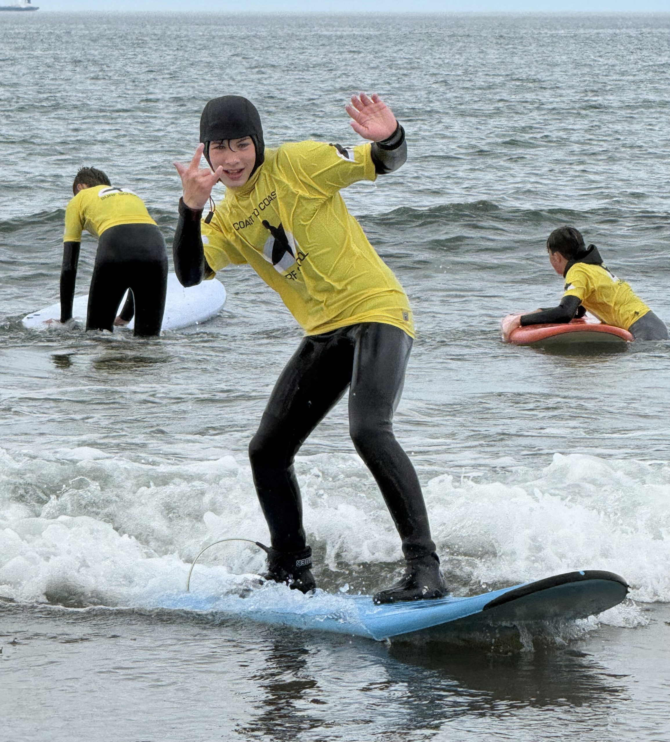 Young people taking part in a surfing activity