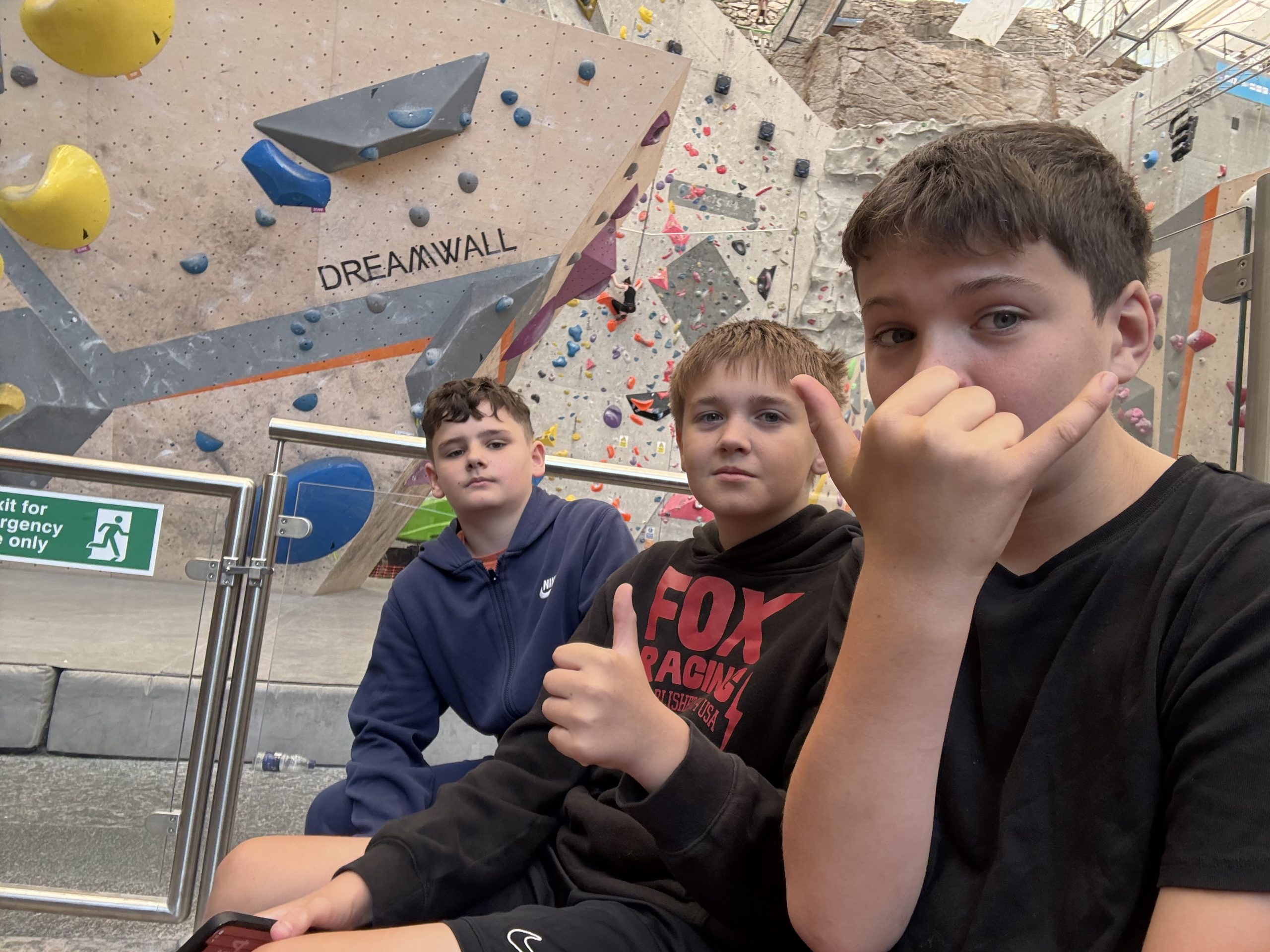 Young people together at an indoor climbing wall