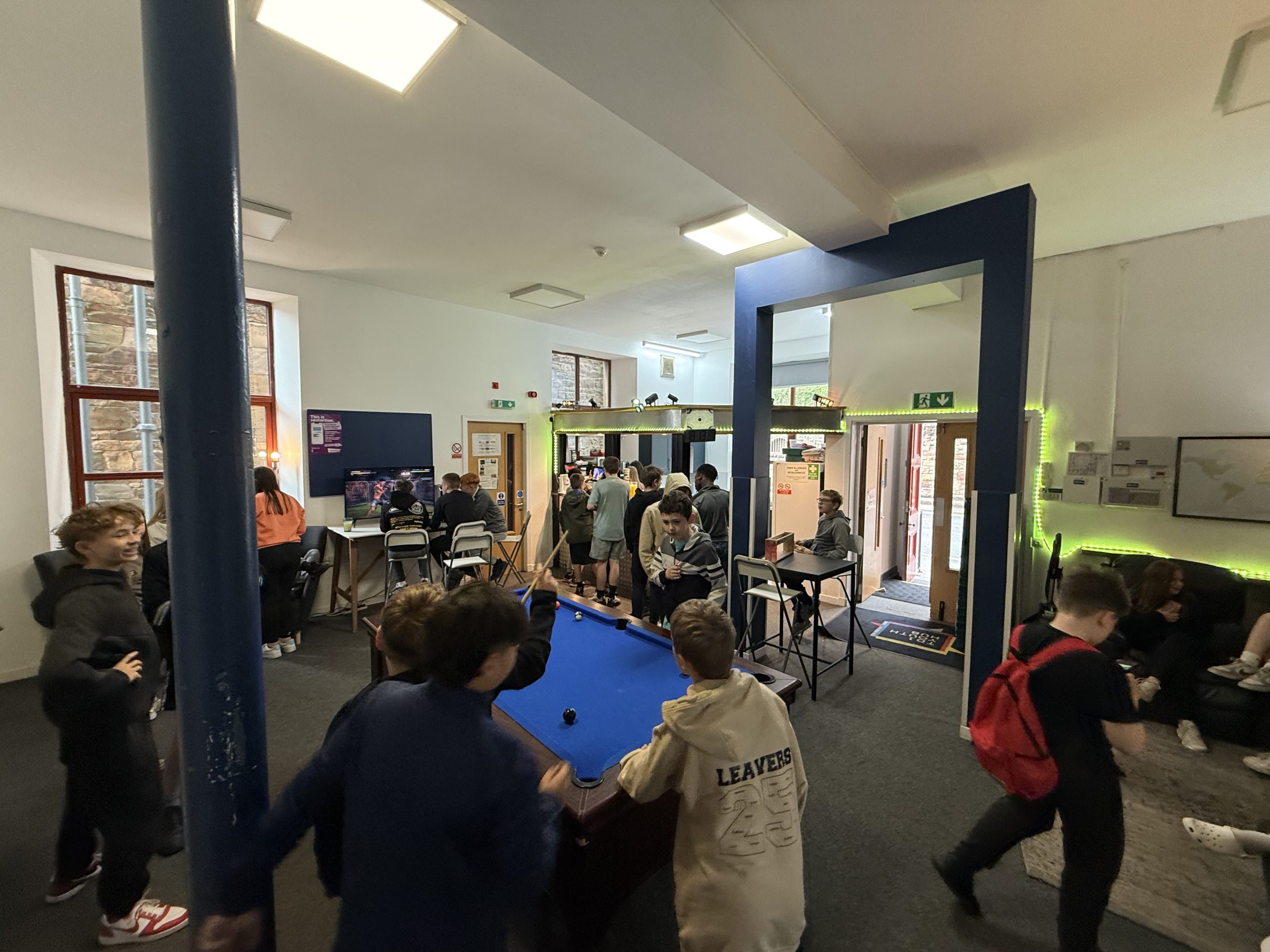 Pool table and activity space inside TD1 Youth Hub