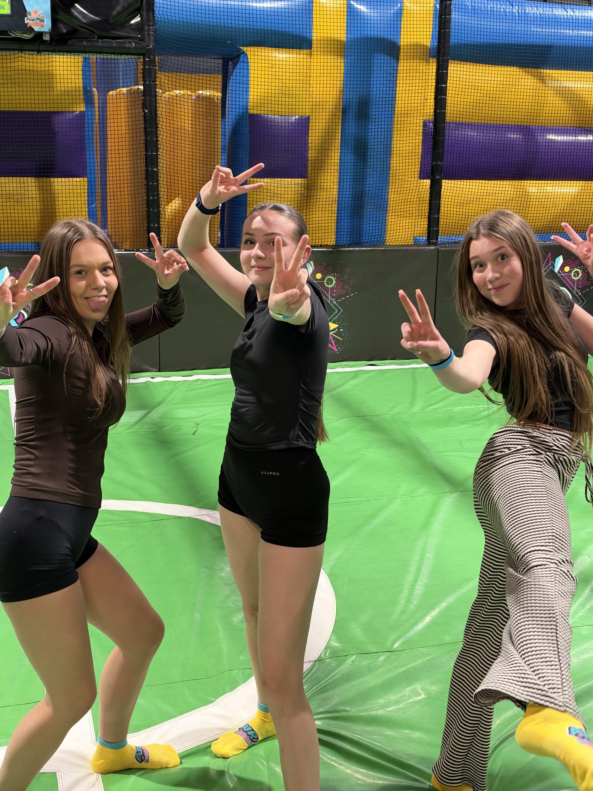 Young people enjoying a trampoline activity together