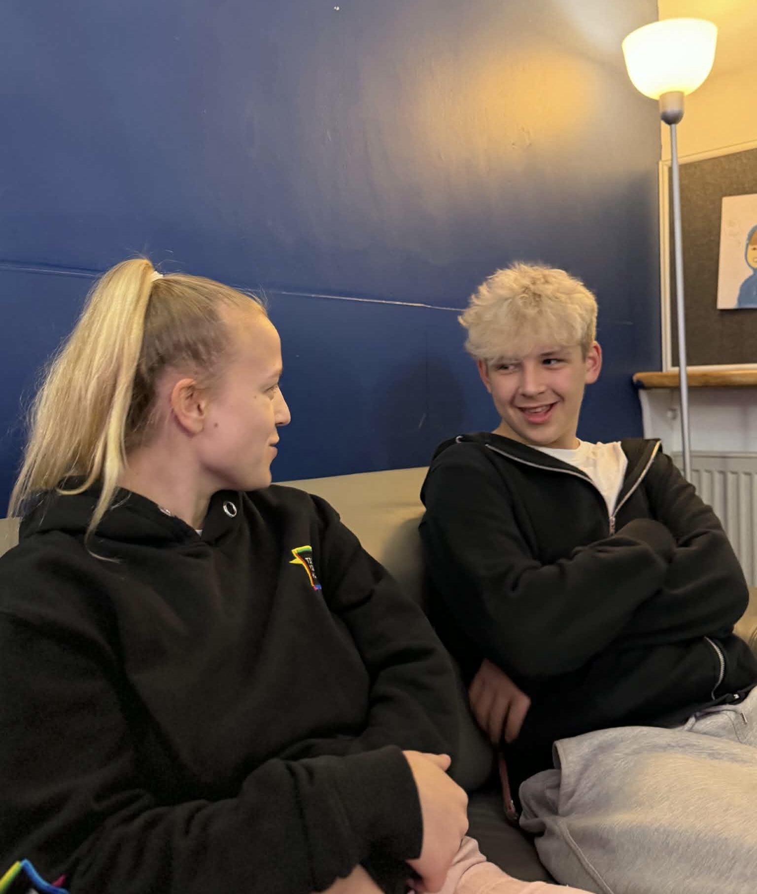 Two people talking together at TD1 Youth Hub